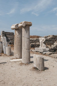 Columns and ruins on the sacred way on the island of delos, greece.