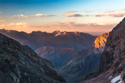 View of mountain range against cloudy sky