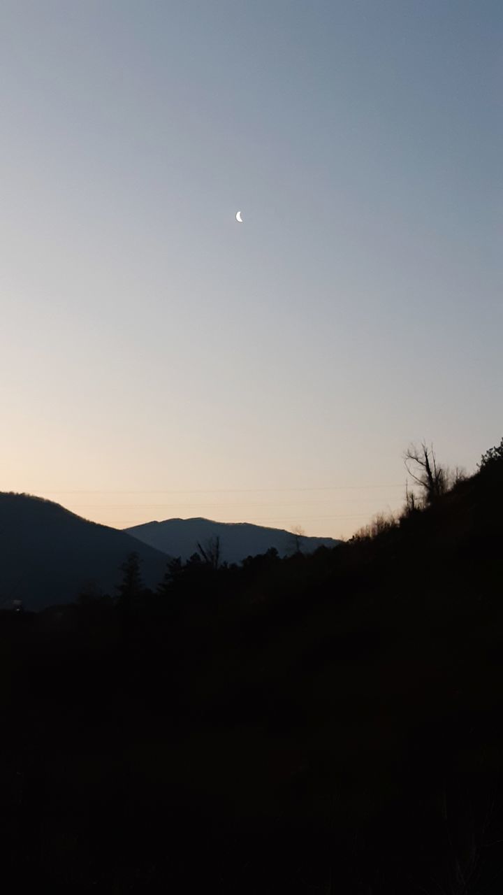 moon, scenics, beauty in nature, nature, tranquil scene, silhouette, no people, copy space, tranquility, tree, landscape, sky, sunset, mountain, clear sky, outdoors, astronomy, crescent, half moon, night, space