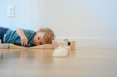Portrait of woman sitting on floor at home