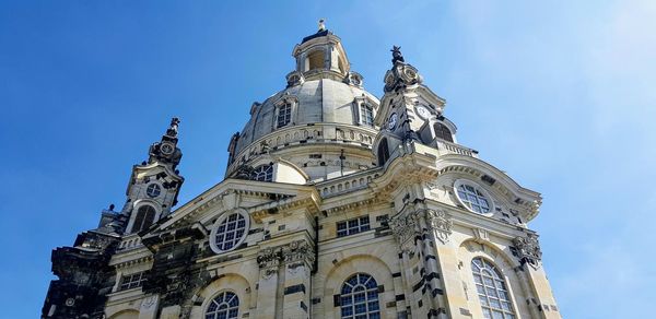 Low angle view of temple building against blue sky