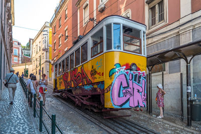 Graffiti on city street amidst buildings