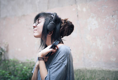 Young woman standing outdoors