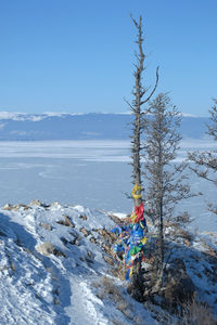 Scenic view of sea against sky during winter