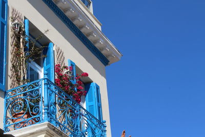 Low angle view of buildings against blue sky