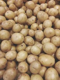 Full frame shot of onions for sale in market