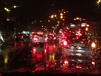 Illuminated city street at night