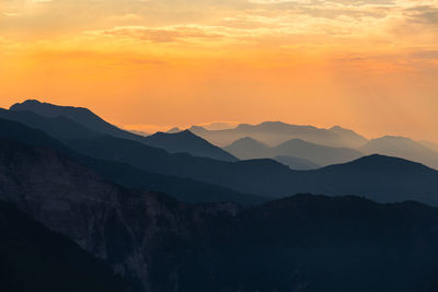 Scenic view of mountains against sky during sunset