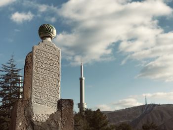 Low angle view of statue against sky