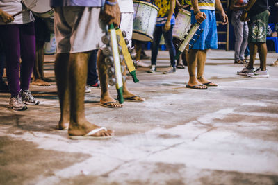 Low section of people standing on street