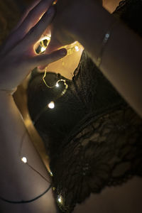 High angle view of hand holding illuminated light