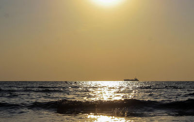 Scenic view of sea against clear sky during sunset