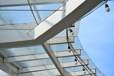 Low angle view of staircase against clear blue sky