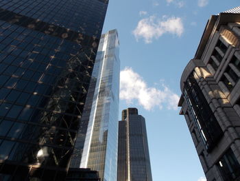 Low angle view of modern buildings against sky