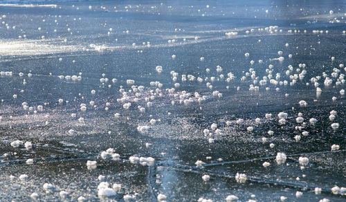 High angle view of city by sea during winter