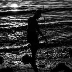 Full length of woman standing on beach