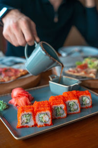 Close-up of sushi served on table