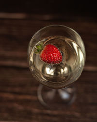 High angle view of strawberries in glass on table