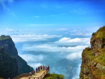 Scenic view of mountains against cloudy sky