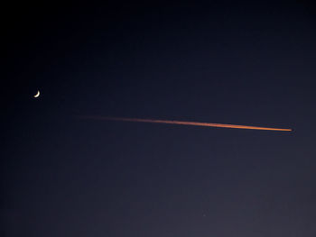 Low angle view of vapor trails in sky