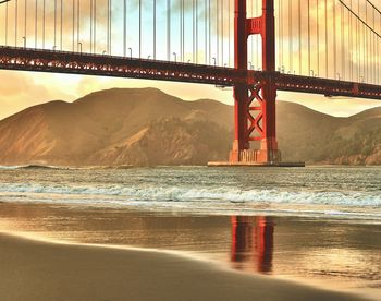 Bridge over sea against sky