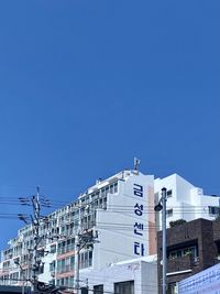 Low angle view of building against blue sky