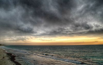 Scenic view of sea against sky at sunset
