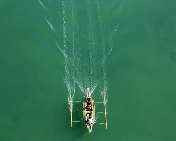 High angle view of people traveling in boat on river