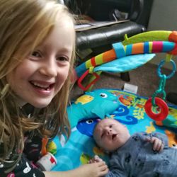 Portrait of a smiling girl with toy