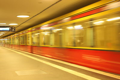 Blurred motion of train moving at subway station