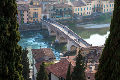 High angle view of people on ponte pietra over adige river