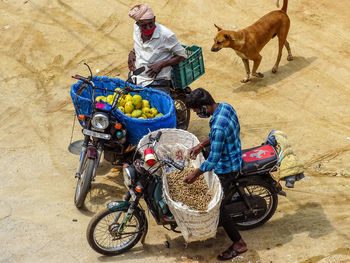 High angle view of sellers in the streets on motorcycle