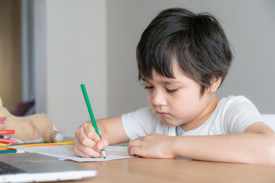 Boy holding table