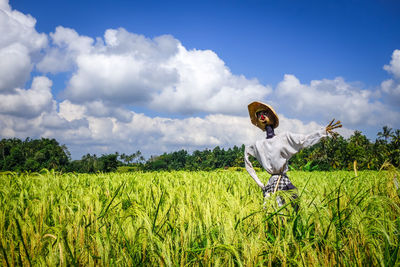 Scenic view of agricultural field against sky