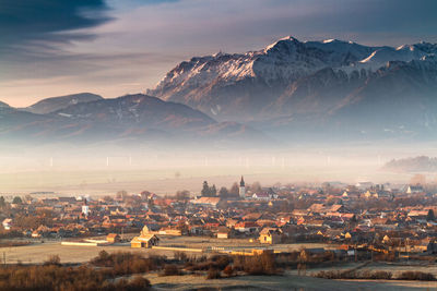 Autumn mist in the village of vulcan, romania