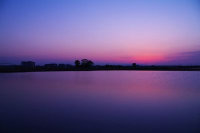 Scenic view of sea against sky at dusk