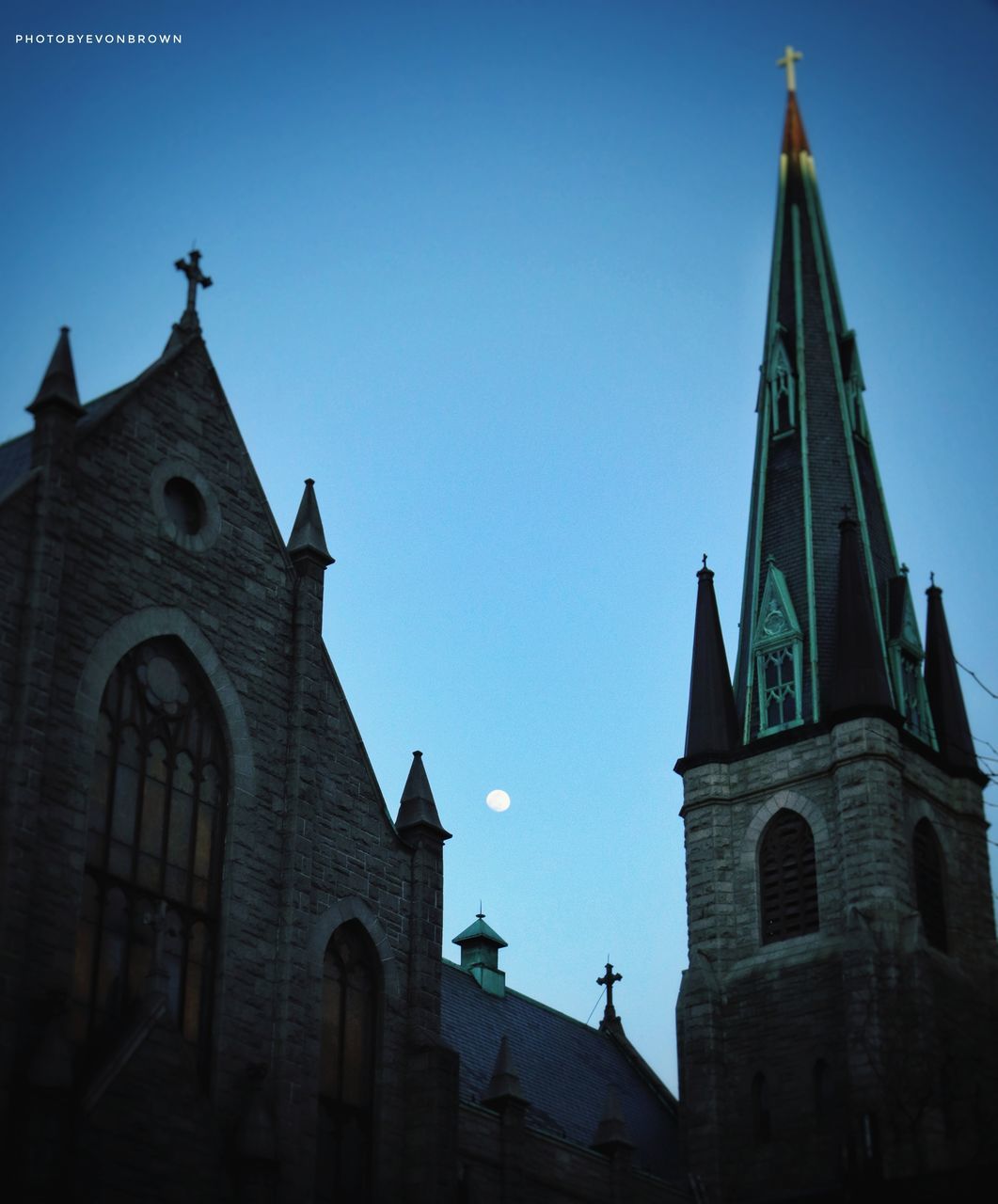 architecture, built structure, building exterior, religion, place of worship, belief, building, spirituality, sky, spire, tower, travel destinations, nature, low angle view, no people, blue, steeple, catholicism, history, the past, clear sky, worship, screenshot, travel, outdoors, city, landmark, day