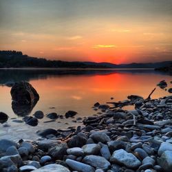 Scenic view of lake at sunset