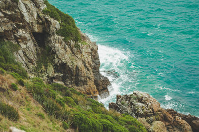 High angle view of rocks on sea