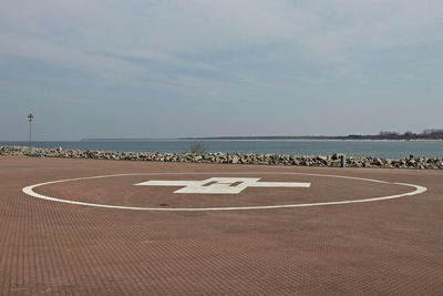 Text on beach against sky