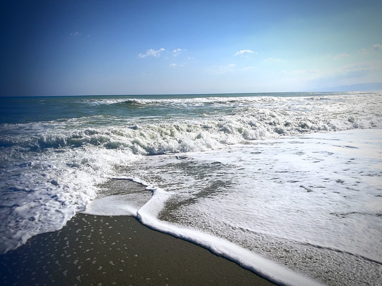 sea, water, horizon over water, horizon, sky, land, beach, beauty in nature, scenics - nature, motion, wave, aquatic sport, tranquil scene, nature, sport, tranquility, surfing, idyllic