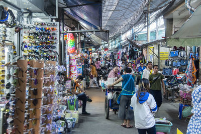 People at market stall in city