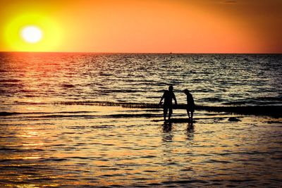 Scenic view of sea at sunset