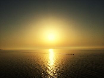 Scenic view of sea against sky at sunset