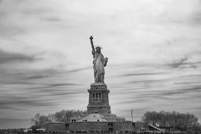 Low angle view of statue against sky