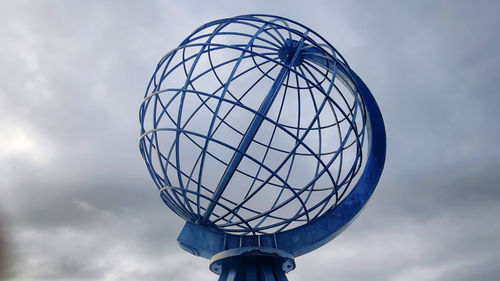 Low angle view of communications tower against sky