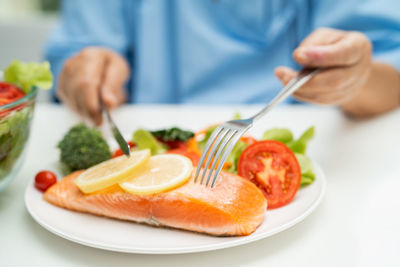 Midsection of man having food