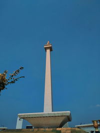 Low angle view of monument against blue sky