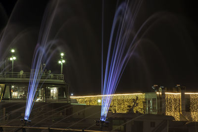 Illuminated fountain at seoul color park against sky