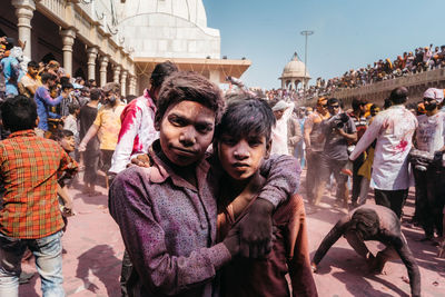 Group of people in front of buildings